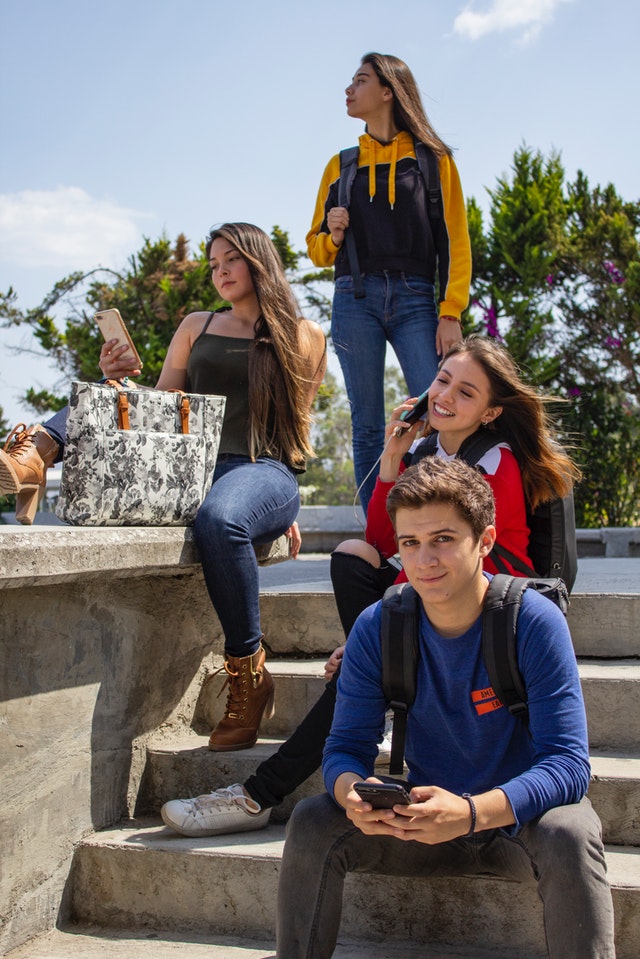 group of people sitting on stairs 2124916